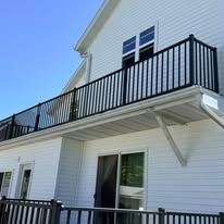 Custom home exterior with new balcony railings